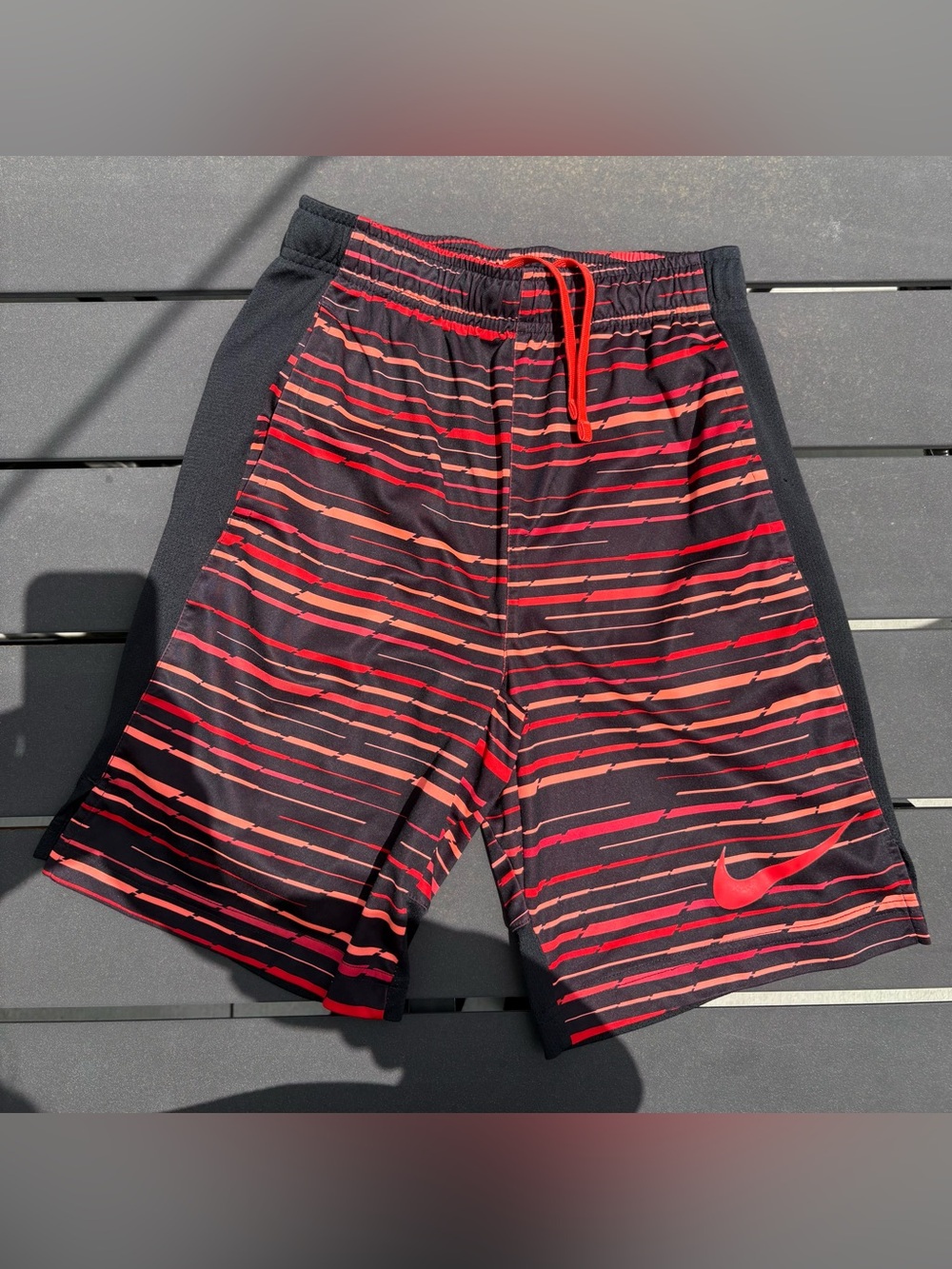 Boys Nike Black Shorts with Red & Orange Stripe Accent- size M